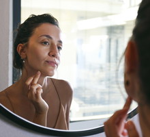 Young woman doing anti ageing facial procedures in the morning