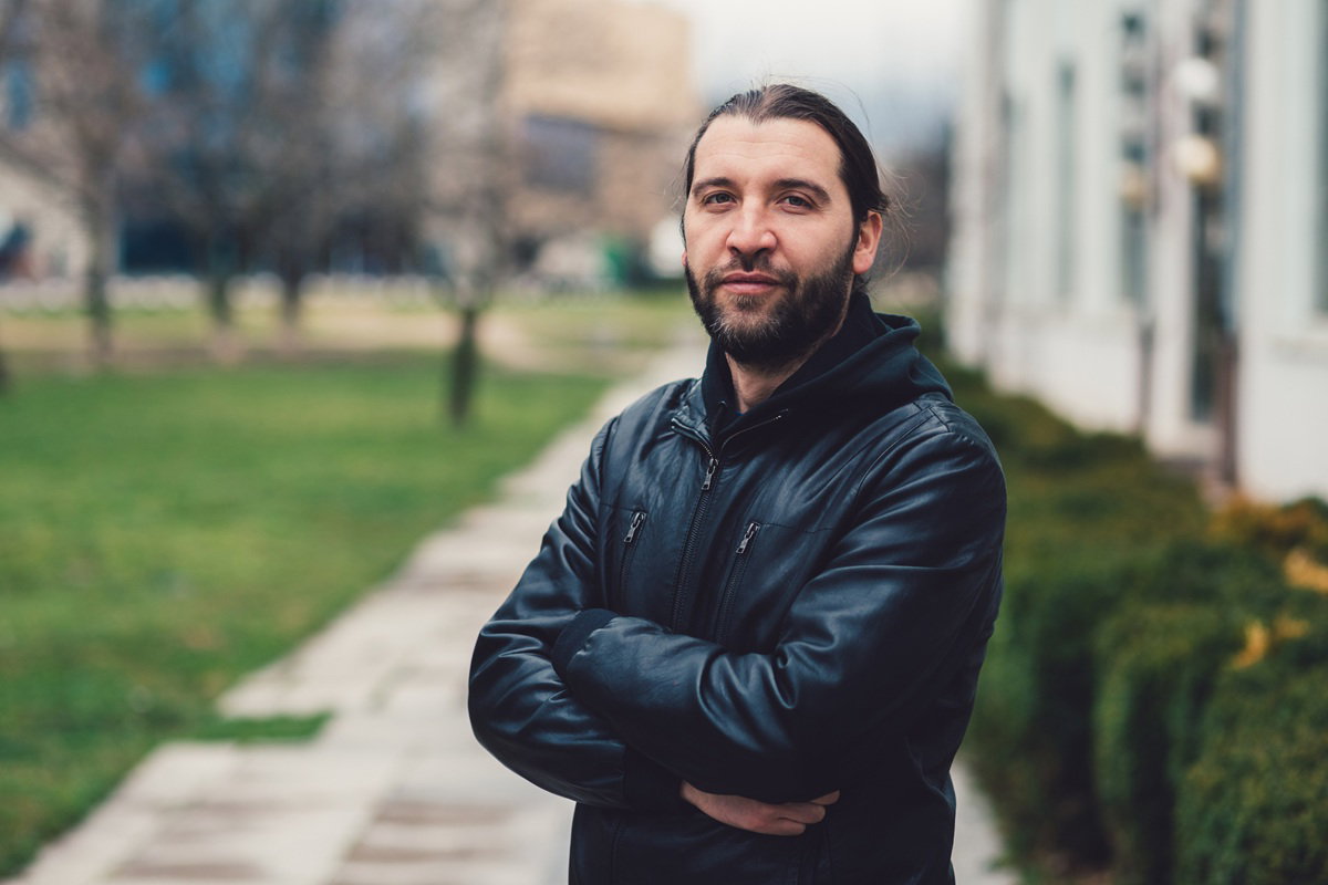 Mid adult man looking at camera