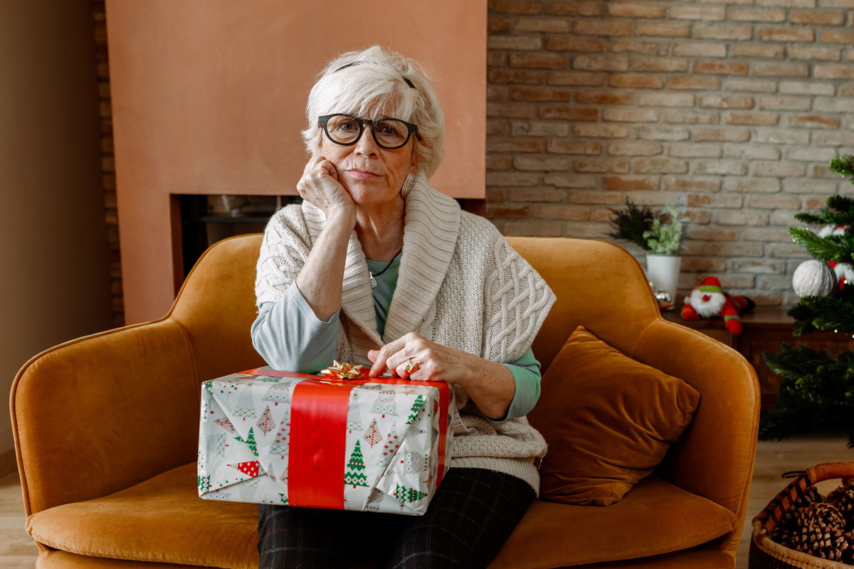 Elderly woman sad and alone at Christmas.