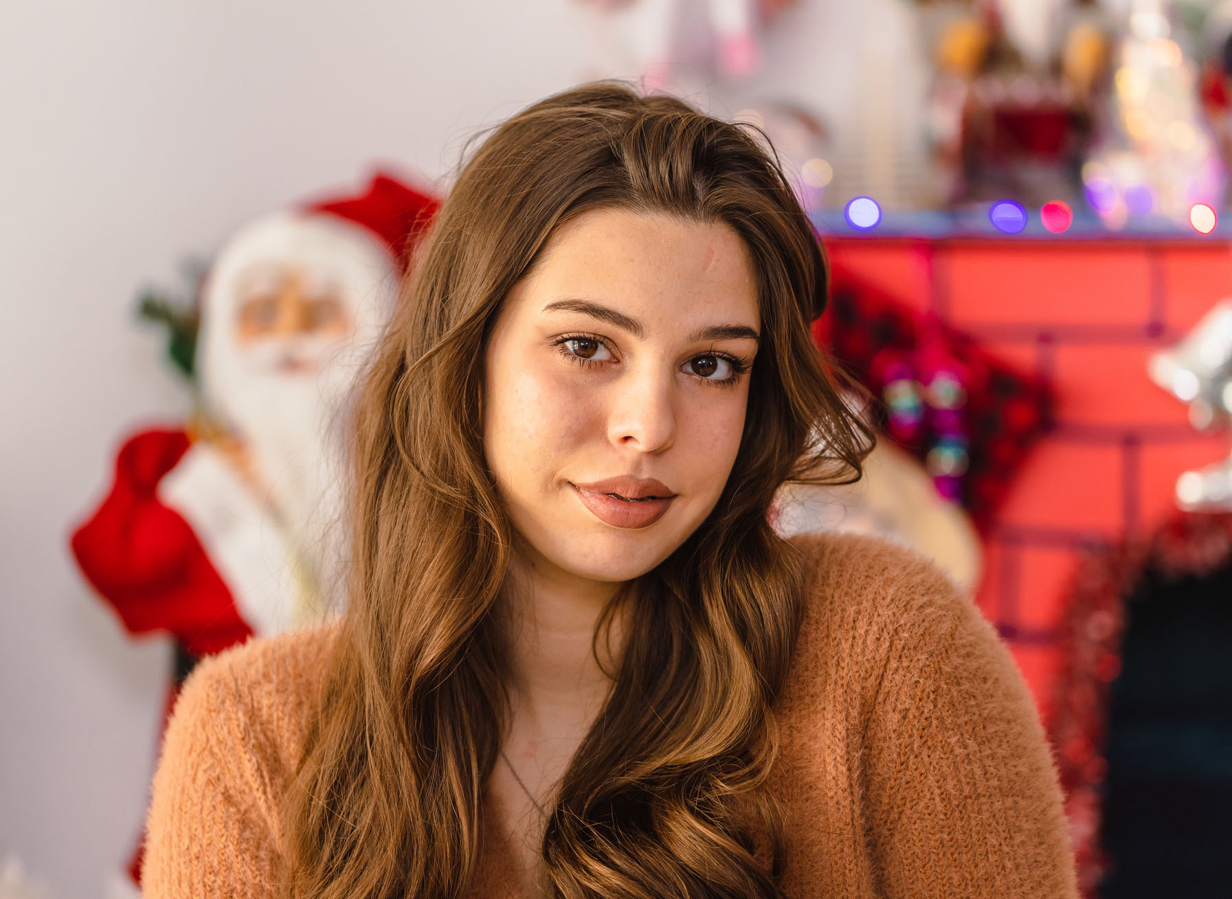 Young Woman in Brown Sweater at Christmas