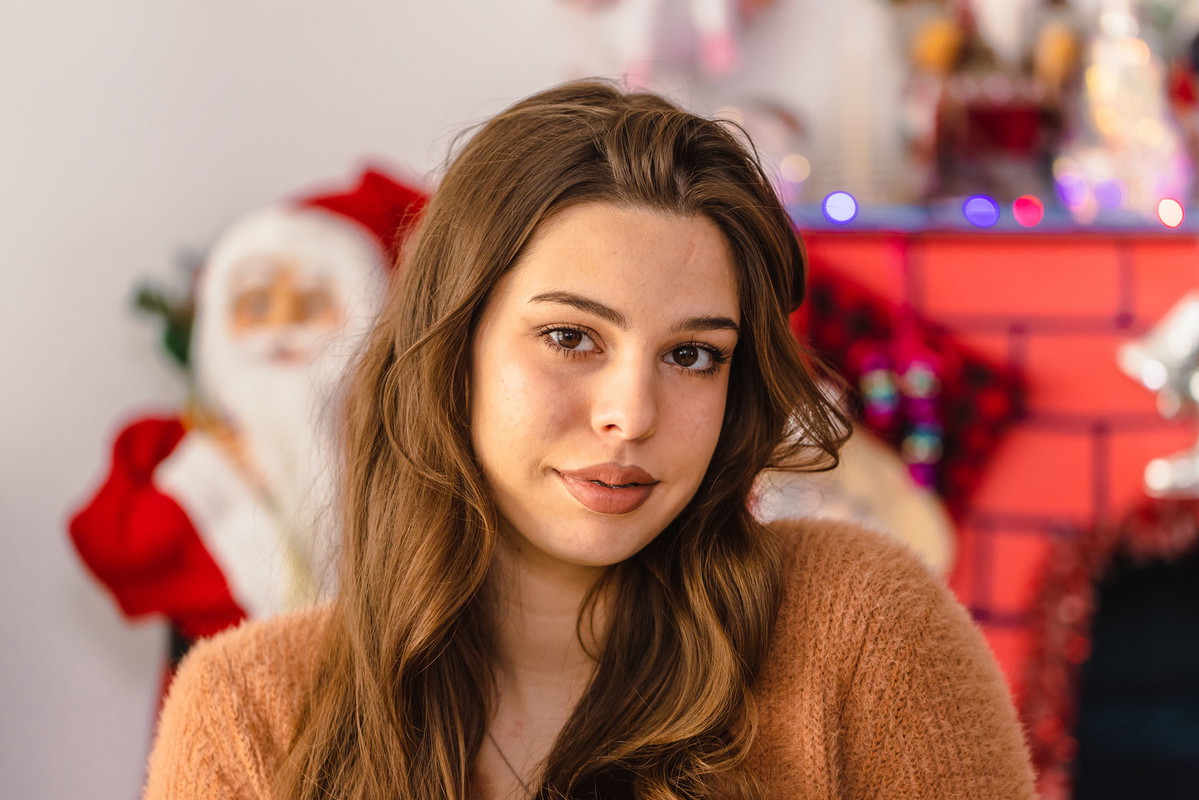 Young Woman in Brown Sweater at Christmas