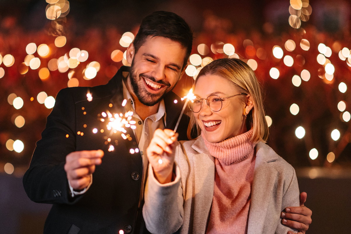 Couple holding sparklers
