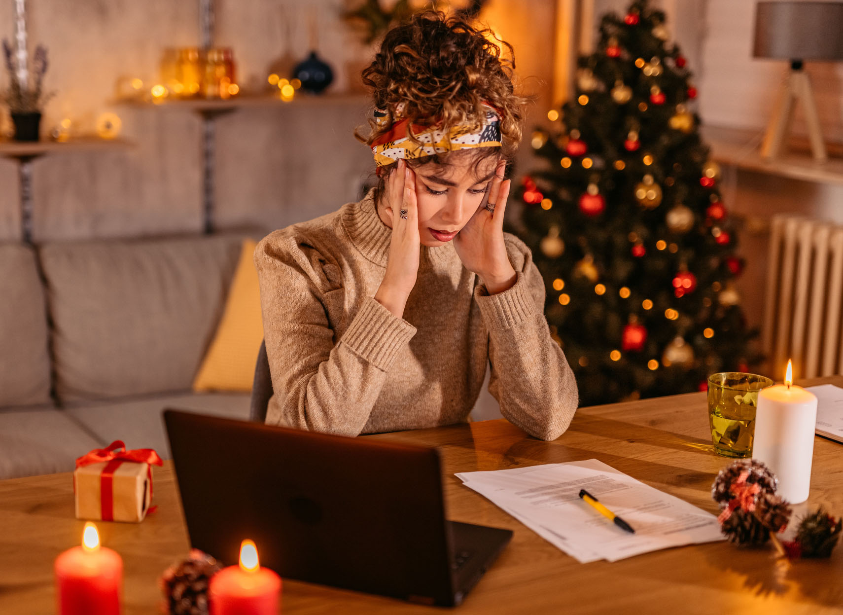 Worried Young Woman Managing Finances At Home During Christmas Holidays