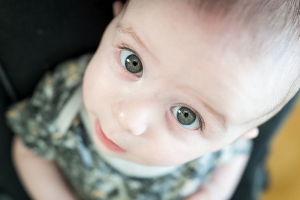 Close up of little cute baby with green eyes ,High quality photo
