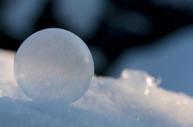 Frozen soap bubble in snow
