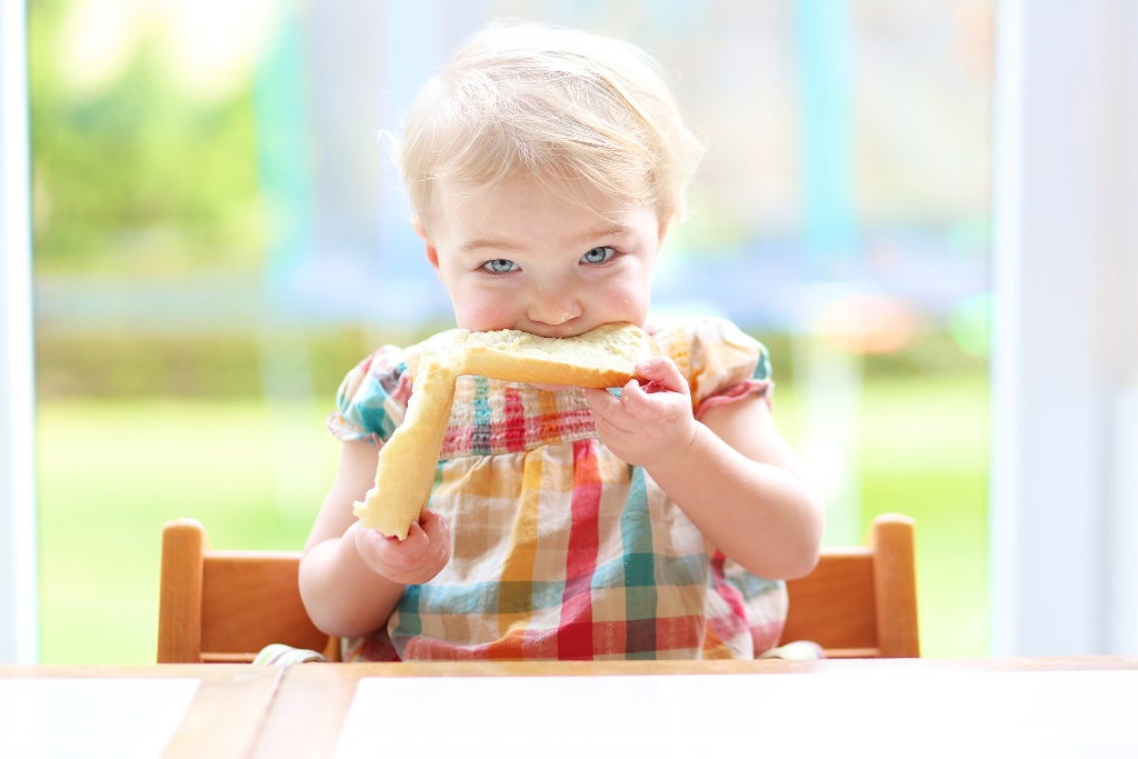 baby eating bread