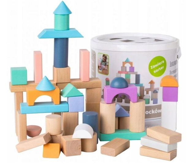 Baby boy playing with wooden toys lying on the Mat. Ecology, education, upbringing concept