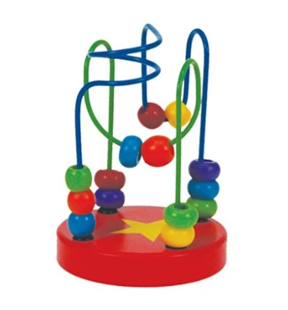 Baby boy playing with wooden toys lying on the Mat. Ecology, education, upbringing concept