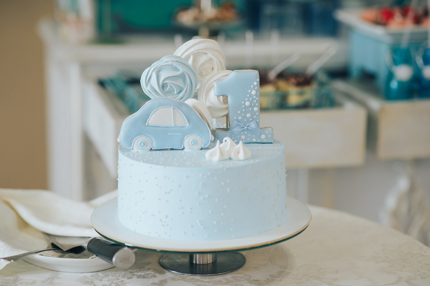First Birthday, cake and teddy bear. Cake with a bear for the first year