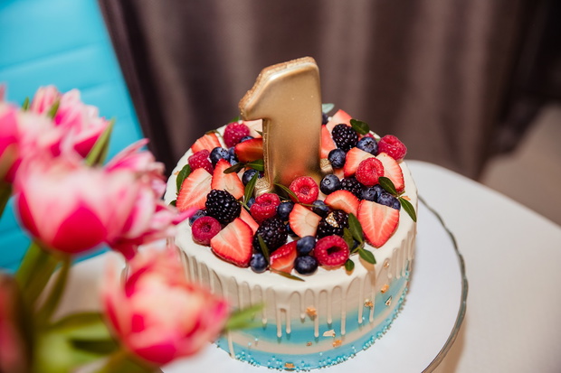 Happy Birthday.Holiday cake with candles.Birthday greetings.Greeting card.celebrate birthday party with gorgeous candy bar. first birthday cake with number 1 ,one on top. first year concept.