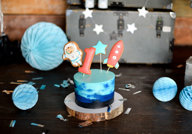One year birthday party. Birthday in Space. Decorations for holiday party. Cake for holiday party.