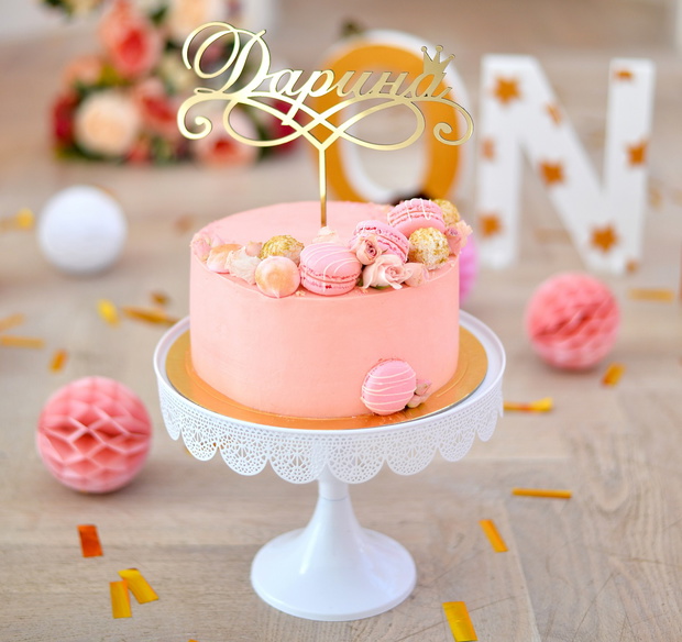 One year birthday decorations. Decorations for holiday party. A lot of balloons yellow and pink colors. Cake for birthday party.