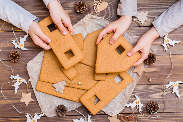 Parts of a disassembled Christmas gingerbread house in children'