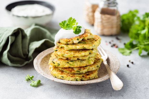 Vegetarian zucchini fritters with sour cream and cilantro
