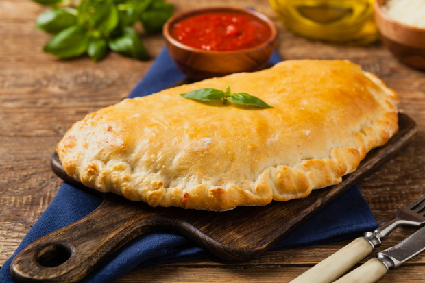 Italian calzone with mushrooms and ham.