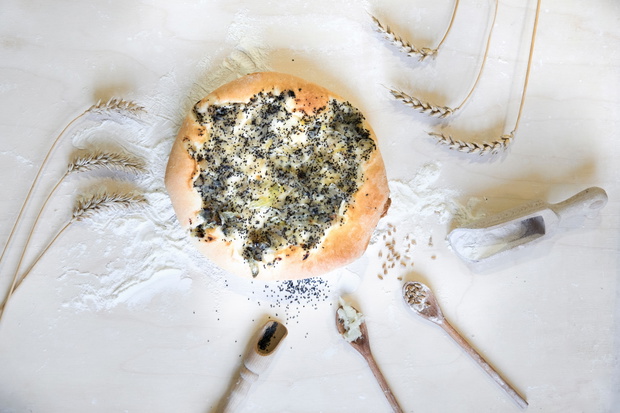 Flat lay composition of ingredients: flour, onion, wheat, onion