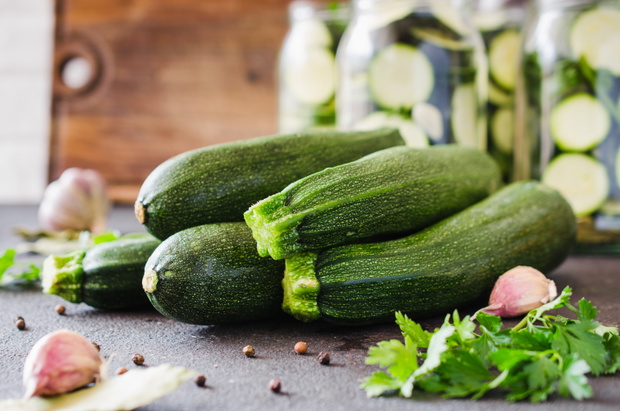 Fresh organic zucchini, garlic and parsley, herbs and spices.