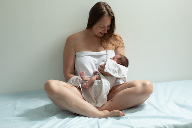 Woman with new born baby have a rest