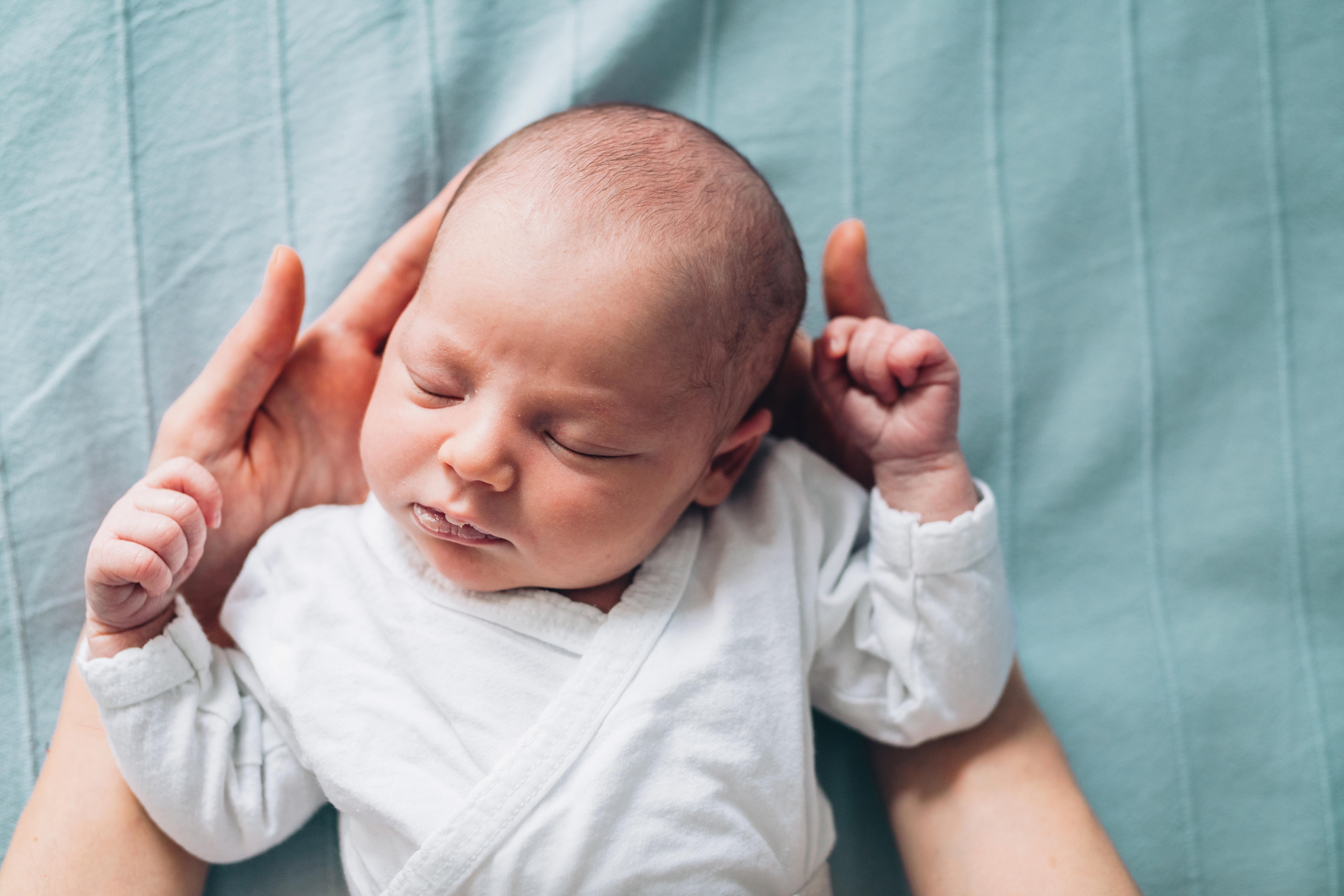 Newborn Baby in Mother's Hands