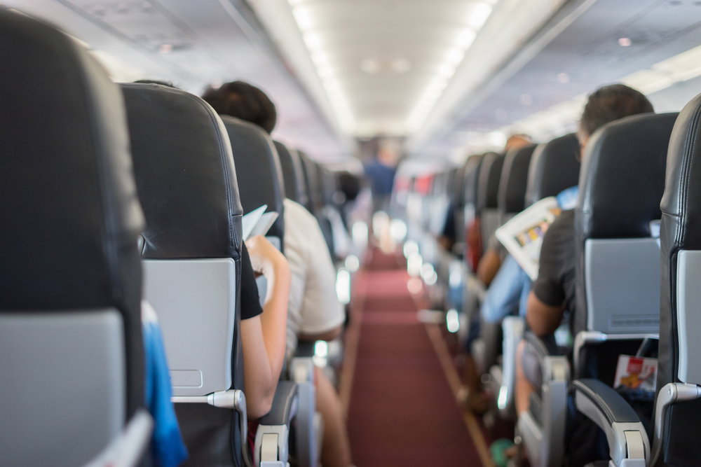 Passenger,Seat,,Interior,Of,Airplane,With,Passengers,Sitting,On,Seats