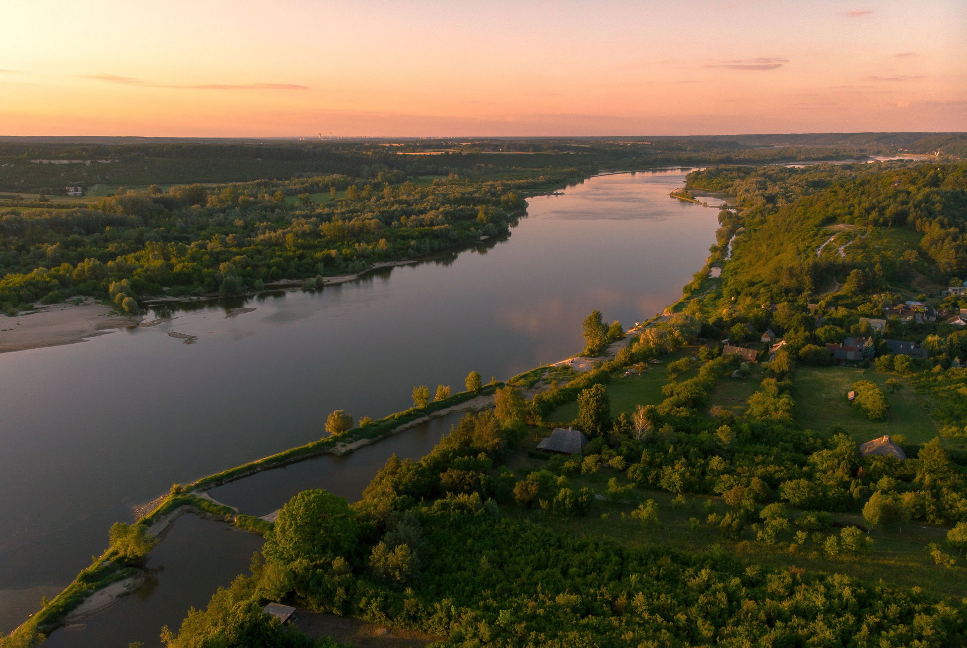 Scenic View Of Landscape Against Sky During Sunset