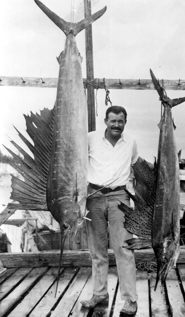 Portrait_of_author_Ernest_Hemingway_posing_with_sailfish_Key_West,_Florida