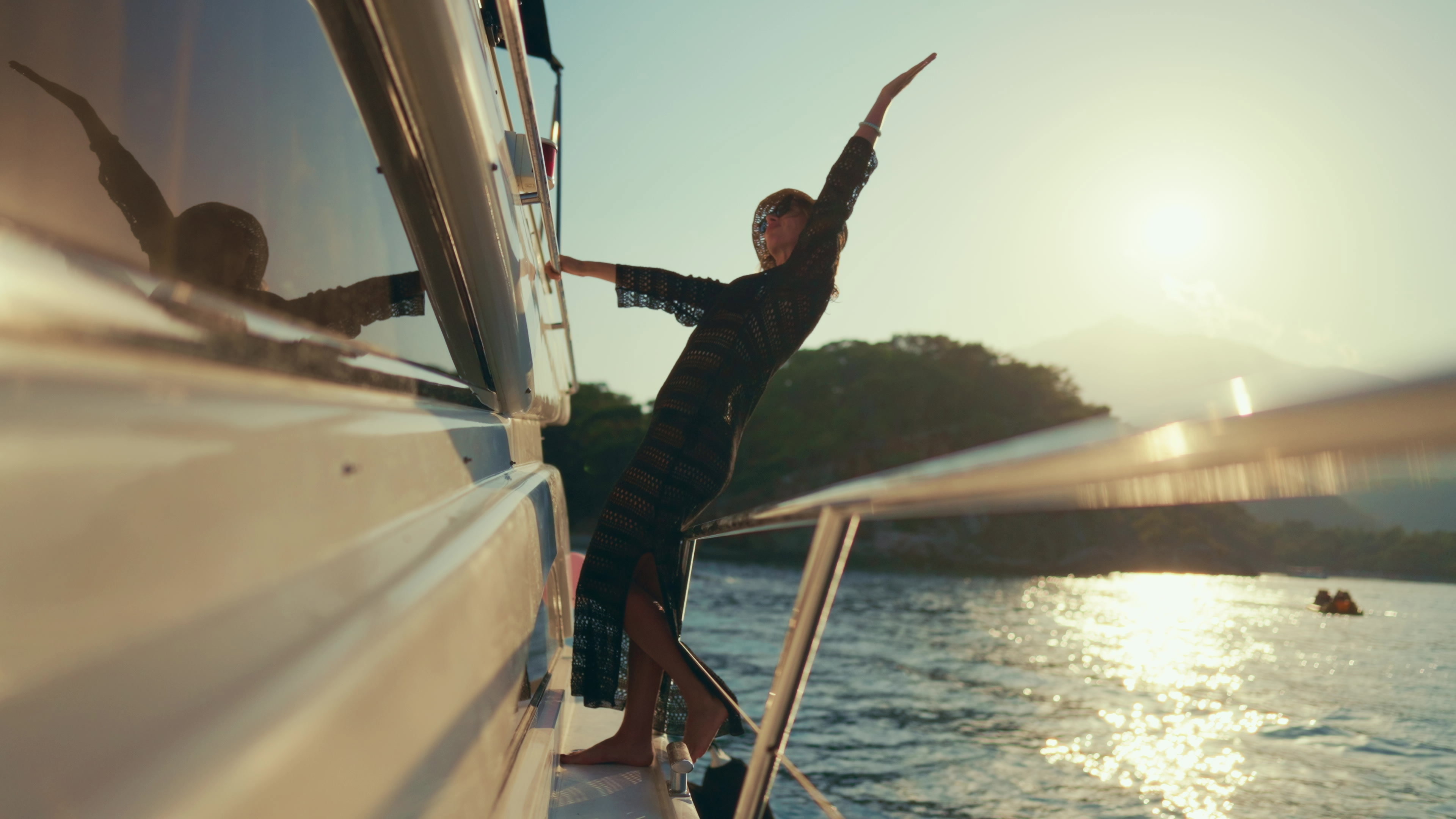 Joyful,Adult,Woman,Traveling,By,Yacht,,Enjoying,Luxury,Life,,Slow