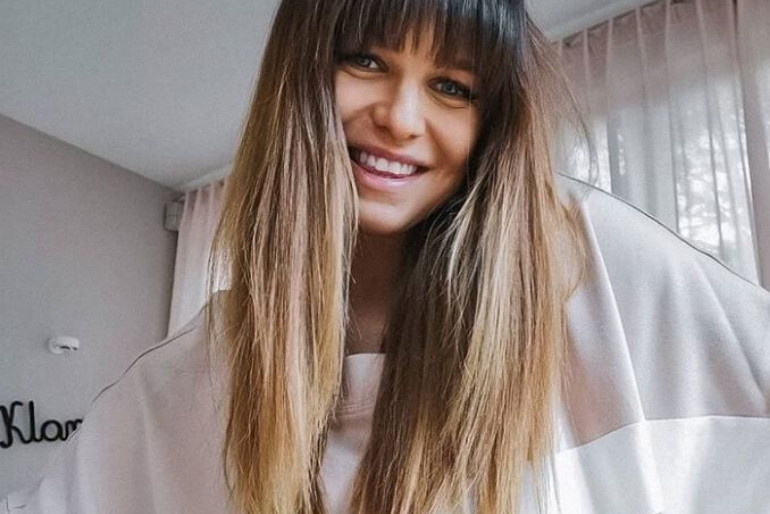 Anna Lewandowska w beżowej bluzie