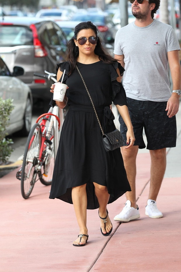 A pregnant Eva Longoria spotted wearing all black running errands in Miami Beach with some friends after a lunch with her husband Jose Baston and her friend, actress Olivia Munn