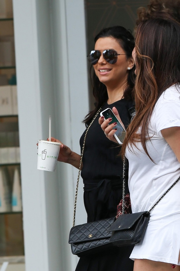 A pregnant Eva Longoria spotted wearing all black running errands in Miami Beach with some friends after a lunch with her husband Jose Baston and her friend, actress Olivia Munn