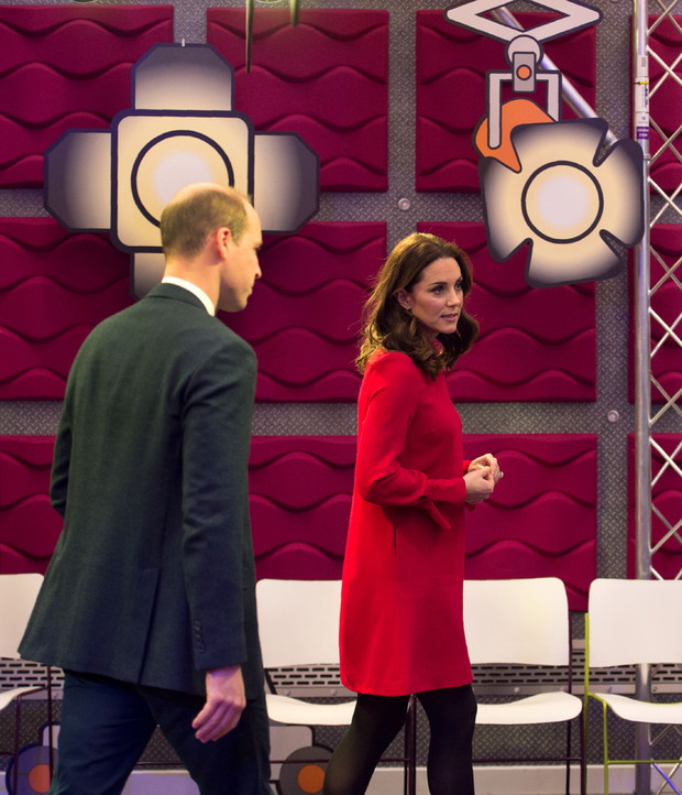 Britain's Prince William, Duke of Cambridge and Britain's Catherine, Duchess of Cambridge leave after speaking to school children during a 'Stepping Out' session, at the BBC in MediaCityUK in Salford, north-west England on December 6, 2017. The Duke and