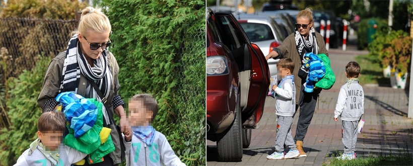 Aneta Zając w szaliku z krate i okularach przeciwsłonecznych na ulicy z synami w szarych dresach