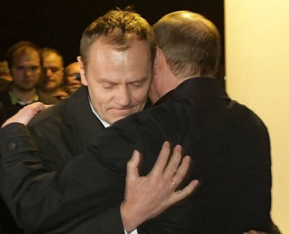 Russia's Prime Minister Putin comforts his Polish counterpart Tusk as they visit the site of a Polish government Tupolev Tu-154 aircraft crash near Smolensk airport