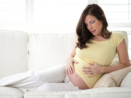 Pregnant woman relaxing on a couch
