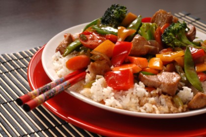Asian pork stir fry with chop sticks