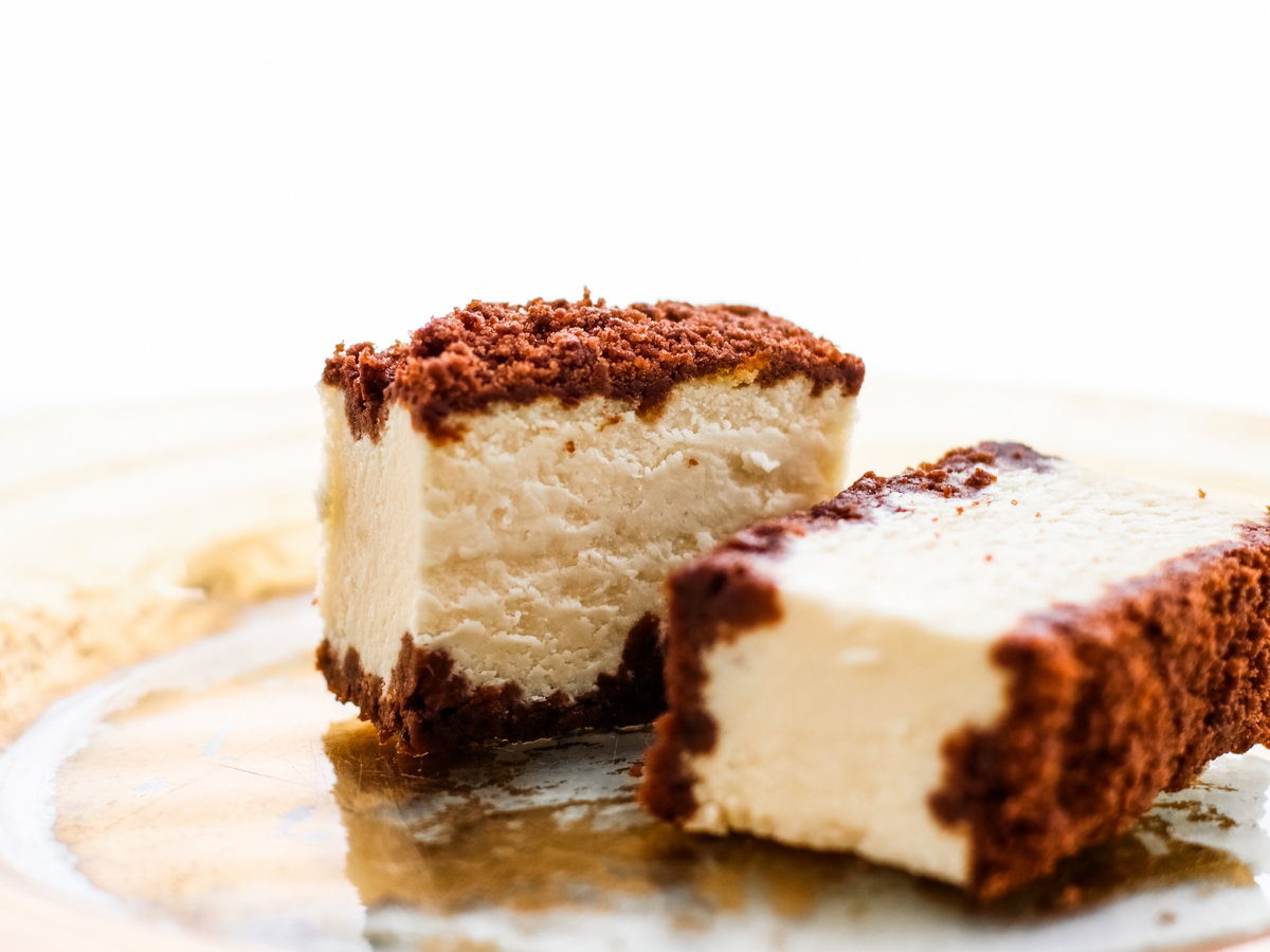 Classic cheesecake with chocolate on a golden plate, european cuisine dessert
