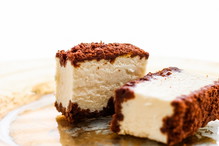 Classic cheesecake with chocolate on a golden plate, european cuisine dessert