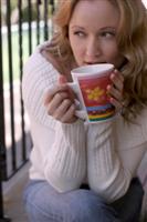 blond woman drinking morning coffee