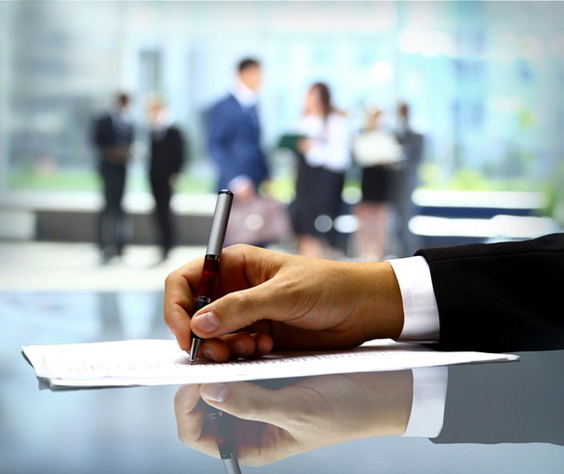 Businessman is signing a contract