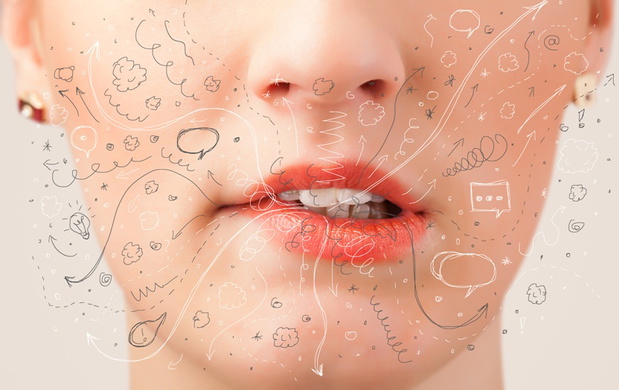 Pretty woman mouth blowing hand drawn icons and symbols close up