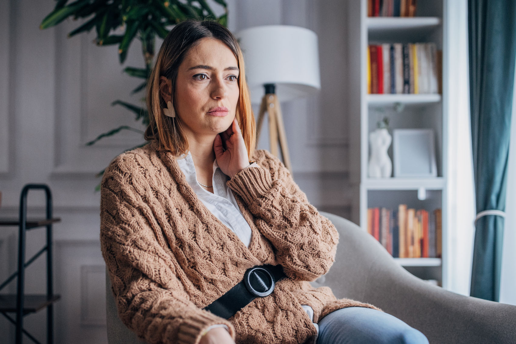 Woman at home thinking about her problems