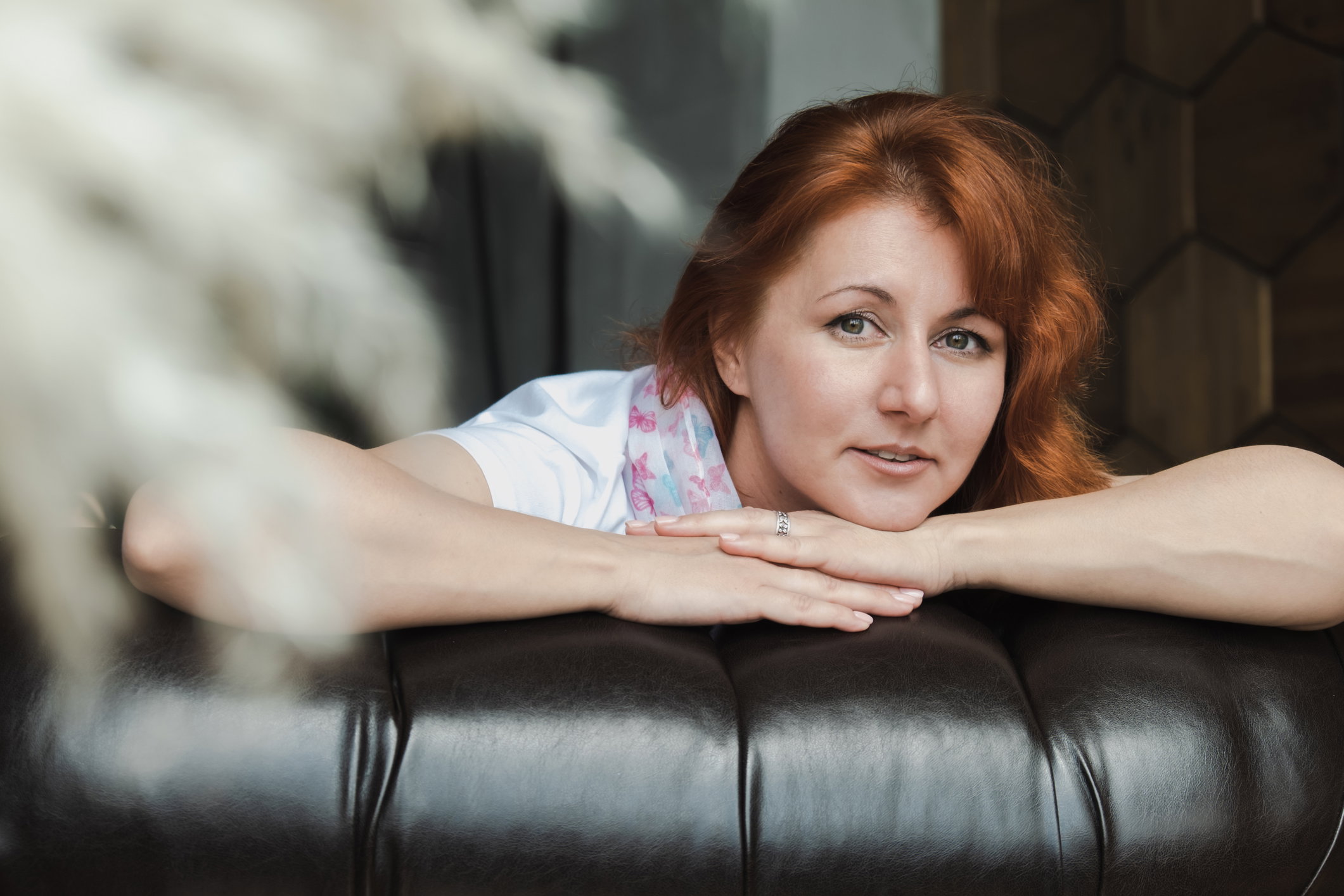 Close-up portrait of a red-haired attractive woman.