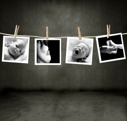 Pictures of a newborn and mother in a darkroom