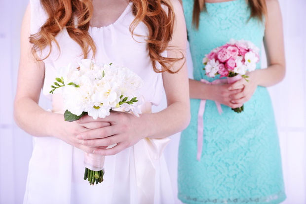 Woman hands holding beautiful wedding bouquet