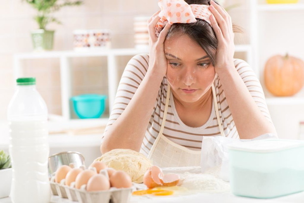 Young woman making dough