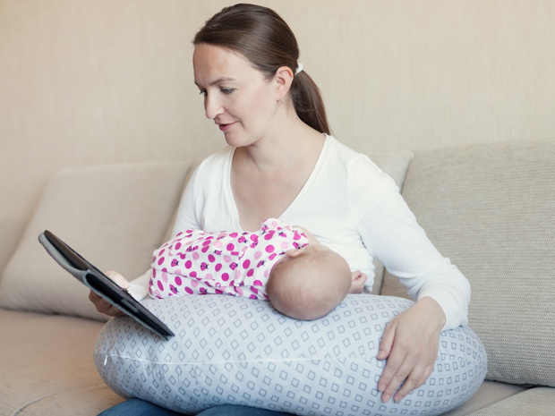 Mother breast feeding her infant