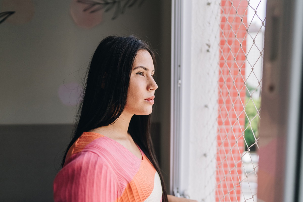 Young woman contemplating at home