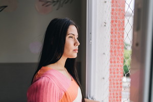 Young woman contemplating at home
