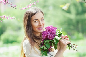 Beautiful young woman in spring garden