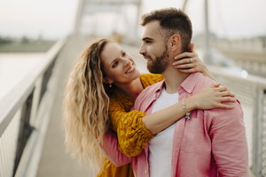 Photo of young couple having fun outdoors